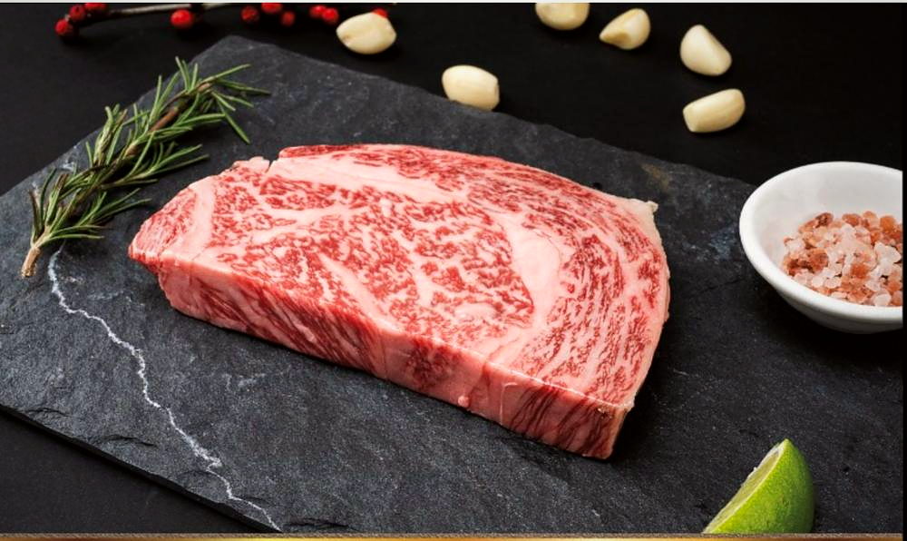 A5 wagyu beef on slate with lime and rock salt