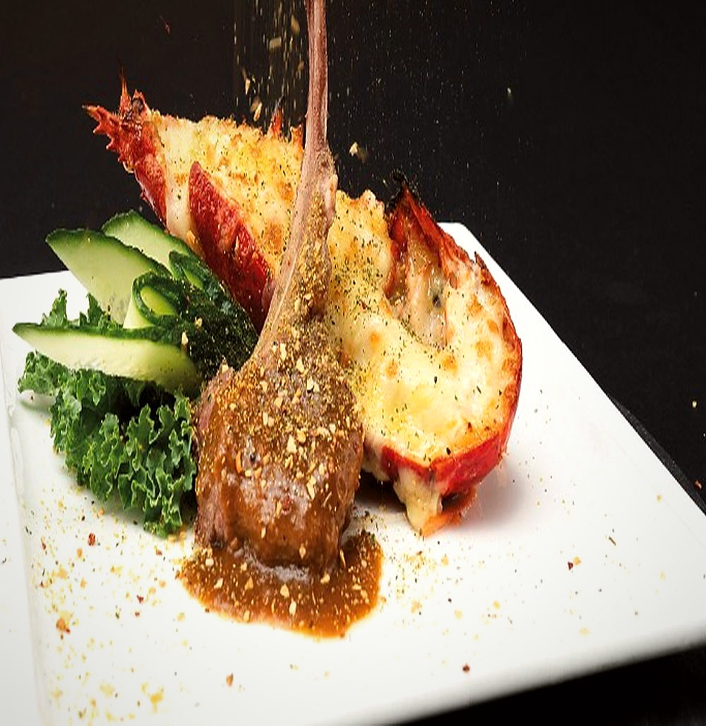 Half prince lobster with a lamb rack in wasabi cream sauce