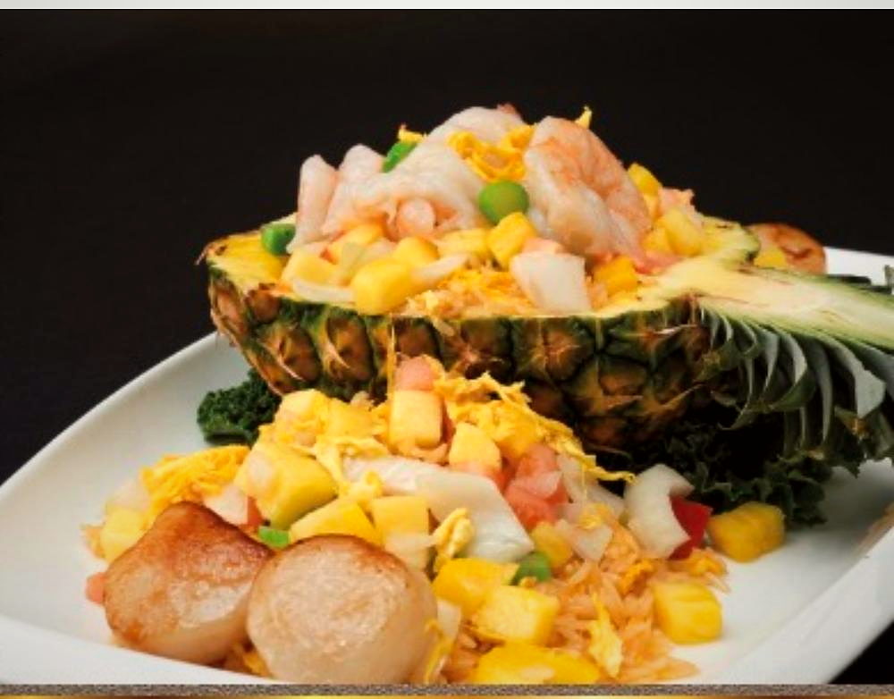 Assorted seafood fried rice in a whole pineapple